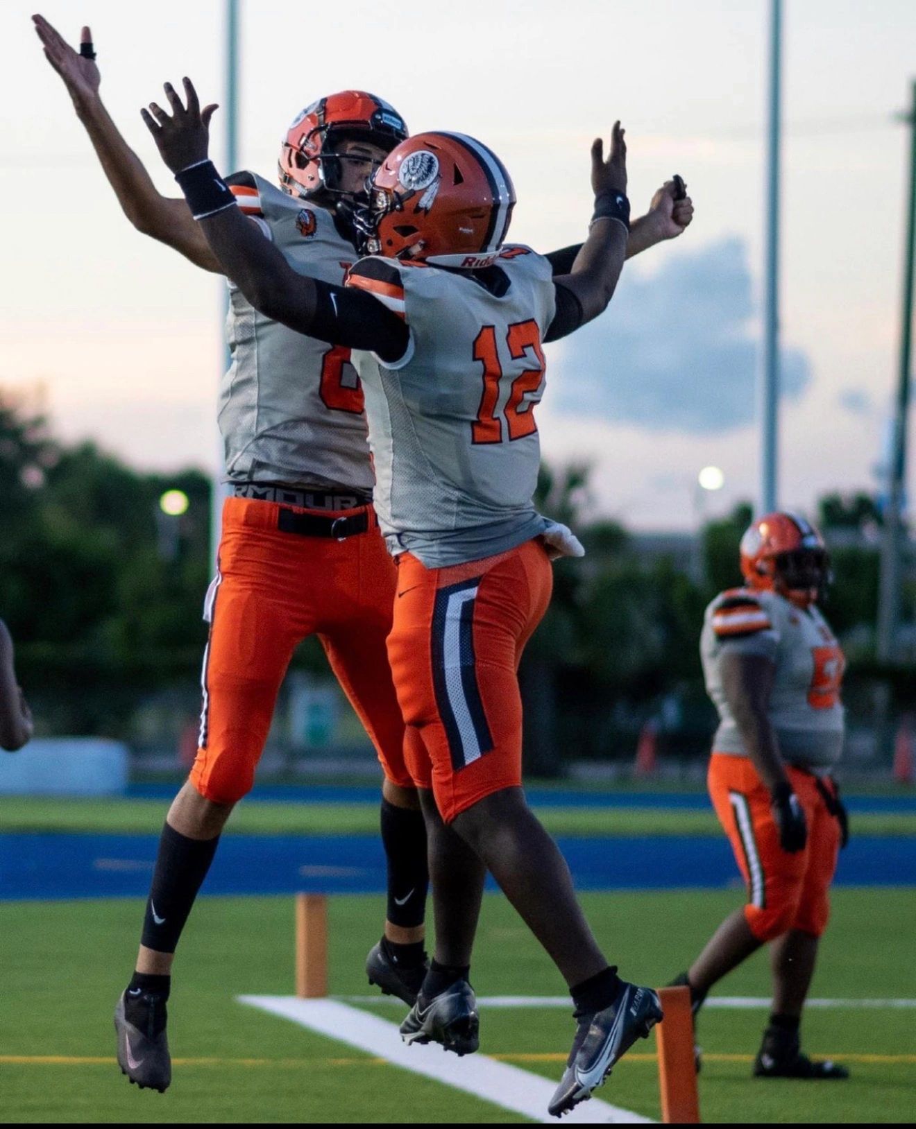 Football players celebrating touchdown